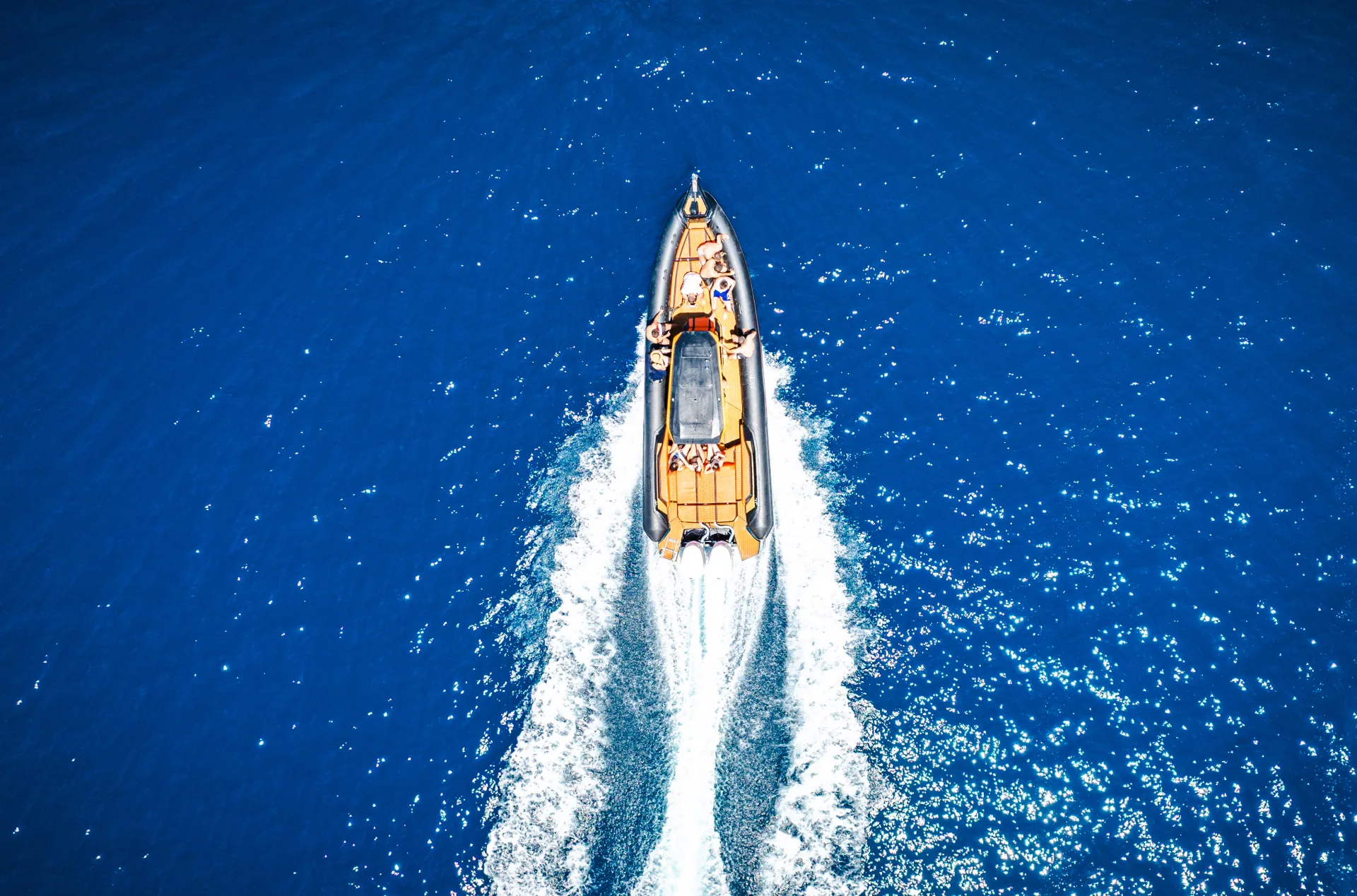 Aerial drone view of the Nemo Boat racing across the Albanian Riviera